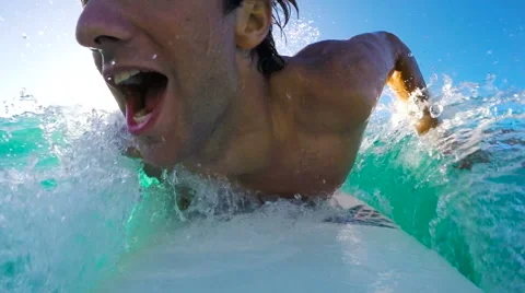 Surfer on Blue Ocean Wave Surfing Down The Line. GOPRO POV SELFIE Stock Footage 57928752