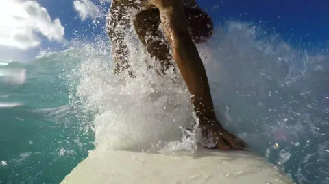 Surfer on Blue Ocean Wave Surfing Down The Line. GOPRO POV SELFIE Stock Footage 57932082