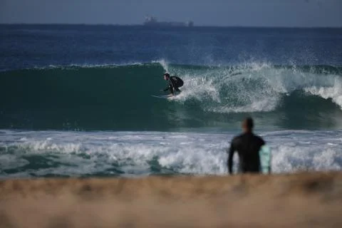 Surfer in the blue Stock Photos