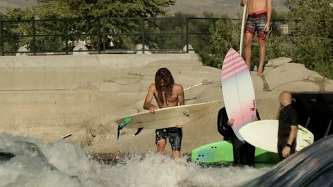 Surfer Bro Attempts River Wave Stock Footage 100034224
