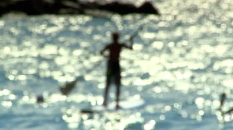 Surfer in a Calm See Stock Footage 22574859