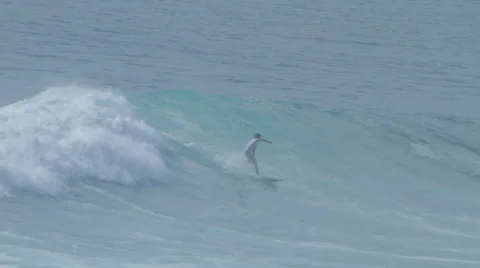 SURFER CATCHES WAVE Stock Footage 27332222