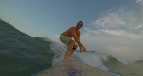 Surfer Catches Wave Stock Footage 34169079