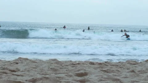 Surfer Catches a Wave To Shore CA 스톡 동영상 211412642