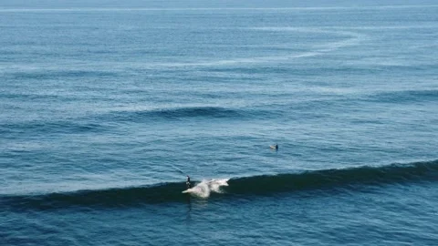 Surfer catching a long wave Stock Footage 161379937