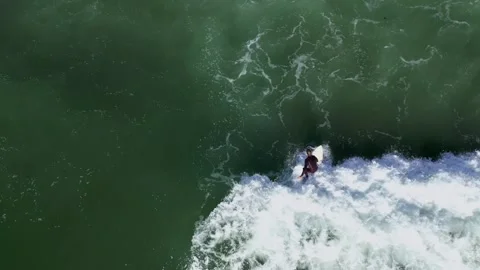 Surfer catching a wave (4K) Stock Footage 264487999