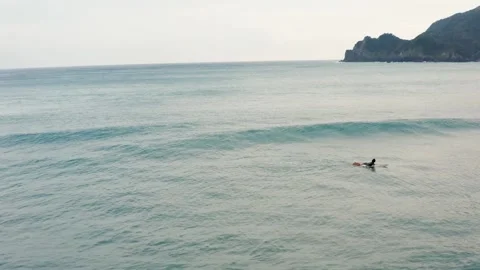 Surfer catching a wave alone Stock Footage 259441849