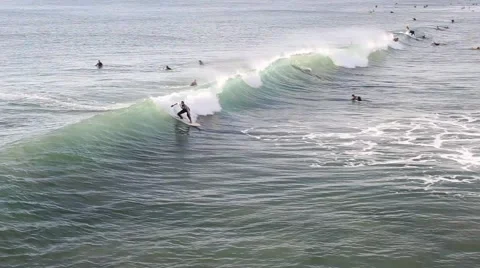 Surfer catching a wave and riding it. Stock Footage 68037121