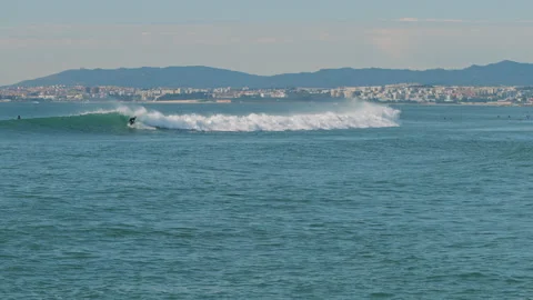 Surfer catching wave in the Atlantic ocean near the Lisbon coast, Portugal. Stock Footage 130626965