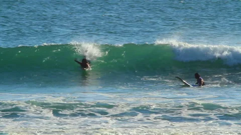 Surfer Catching a Wave in Bali Stock Footage 146936220