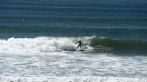 Surfer catching a wave Stock Footage 126669661