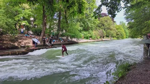 Surfer in the city river called Eisbach at Munich, Germany Stock Footage 281319161