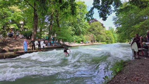 Surfer in the city river called Eisbach at Munich, Germany Stock Footage 281319296