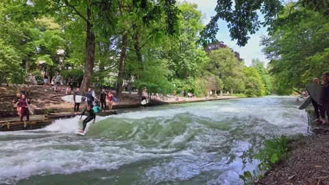 Surfer in the city river called Eisbach at Munich, Germany Stock Footage 281319463