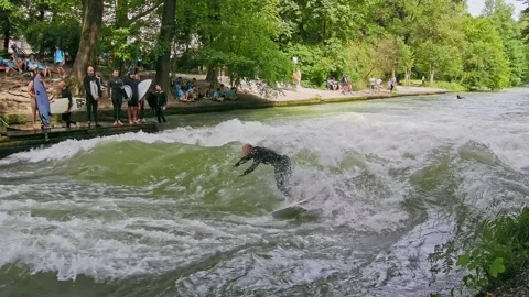 Surfer in the city river called Eisbach at Munich, Germany Stock Footage 282274821
