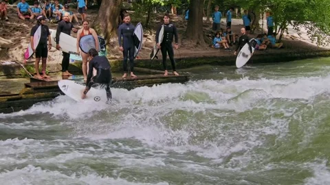 Surfer in the city river called Eisbach at Munich, Germany Stock Footage 282275167