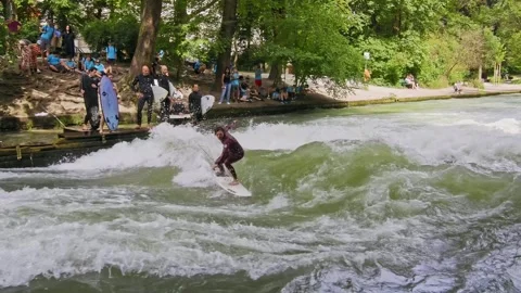 Surfer in the city river called Eisbach at Munich, Germany Stock Footage 282275632