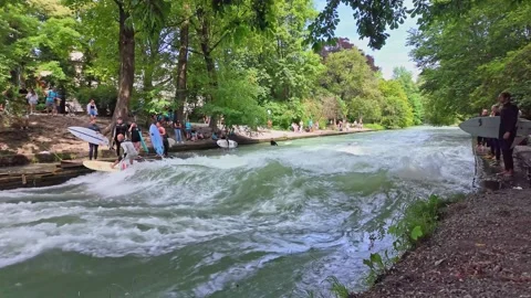 Surfer in the city river called Eisbach at Munich, Germany Stock Footage 282275940
