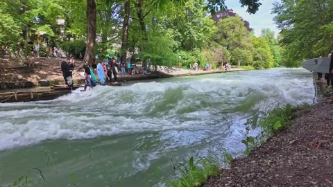 Surfer in the city river called Eisbach at Munich, Germany Stock Footage 284032398