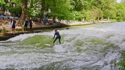 Surfer in the city river called Eisbach at Munich, Germany Stock Footage 287468927