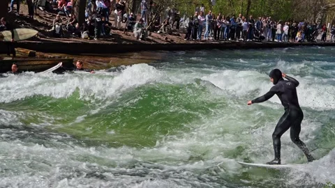 Surfer in the city river called Eisbach at Munich, Germany Stock Footage 307314926
