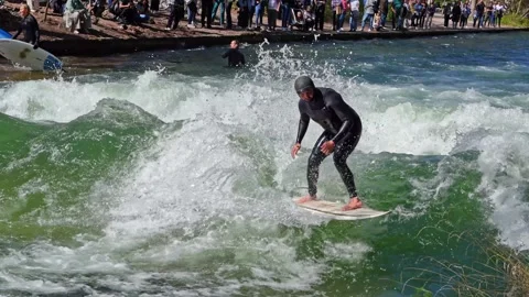 Surfer in the city river called Eisbach at Munich, Germany Stock Footage 307314929