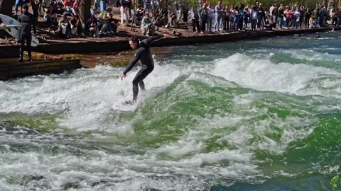 Surfer in the city river called Eisbach at Munich, Germany Stock Footage 307314934