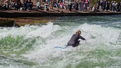 Surfer in the city river called Eisbach at Munich, Germany Stock Footage 307314959