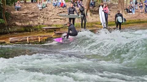 Surfer in the city river called Eisbach at Munich, Germany Stock Footage 307315006