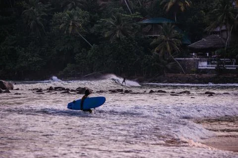 Surfer at coastline Stock Photos