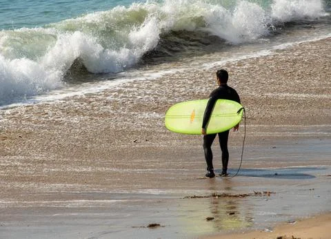 Surfer Contemplates the Wave 스톡 사진