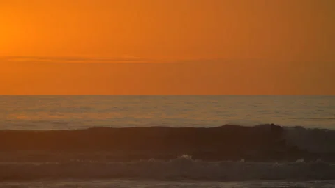 Surfer in Costa Rica At Sun Set Stock Footage 171136890