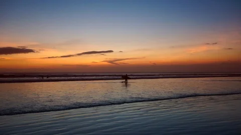 Surfer with desk and ocean waves Stock Footage 110733462