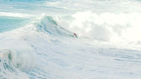 Surfer does a flip in the air with a surf on a big wave, beautiful drop slow 動画素材 132664877