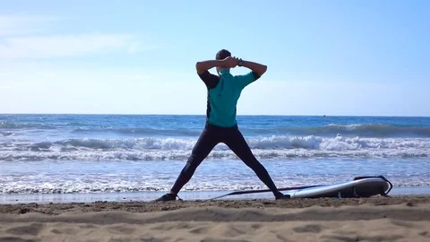 Surfer does gymnastics Stockbeeldmateriaal 85083350