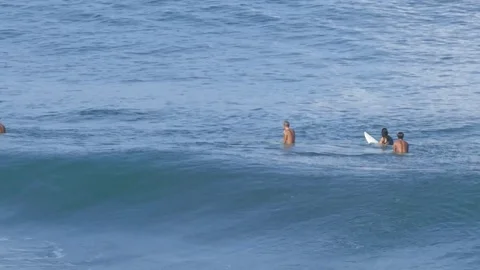 A surfer does a top turn Stock Footage 76149976