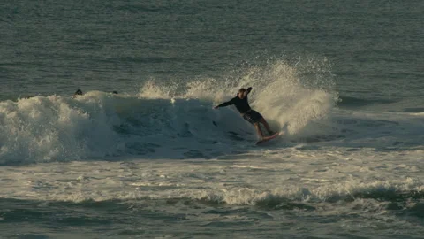 Surfer doing cutback Stock Footage 307312760
