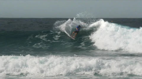Surfer doing several cutbacks on a gold coast wave Stock Footage 64766340