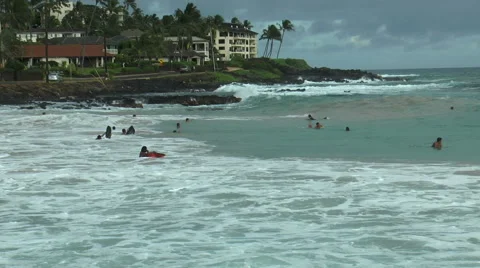 Surfer in dramatic waves at poipu beach, kaui hawaii Stock Footage 40701217