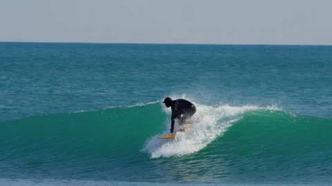 Surfer Dropping Into Green Wave With White Spray Stock Footage 334646684