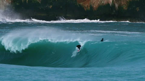 Surfer Dropping Into Heavy Turquoise Wave Stock Footage 334646759