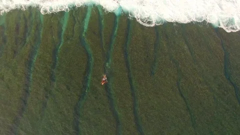 Surfer duck diving under a wave in Indonesia Stock Footage 98678683