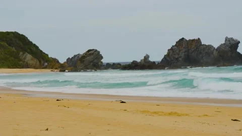 Surfer falling in ocean by the beach Stock Footage 345536408