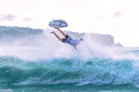 Surfer falling in the water. Stock Photos