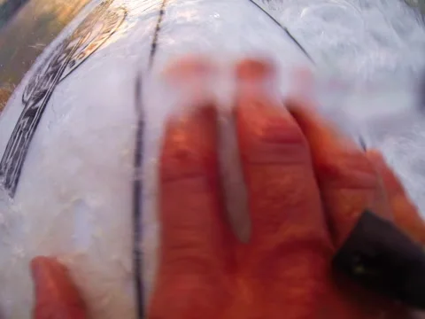 Surfer falls and surfaces Stock Footage 42545349