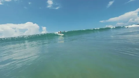 Surfer falls on the wave in ocean Stock Footage 174350995