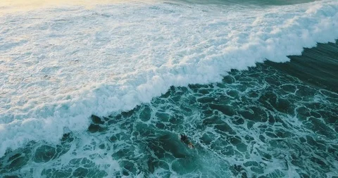 Surfer fights off waves Stock Footage 106915472