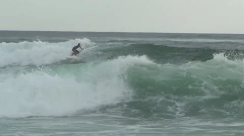 Surfer flips over wave in Costa Rica Stock Footage 917281