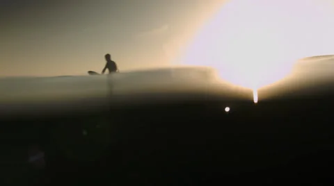 Surfer Floating In Water with Camera in Water Stock Footage 39210694