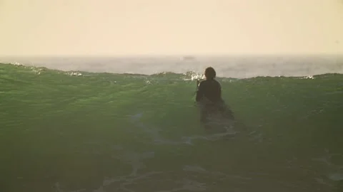 Surfer floats over large wave slow motion Stock Footage 146822881
